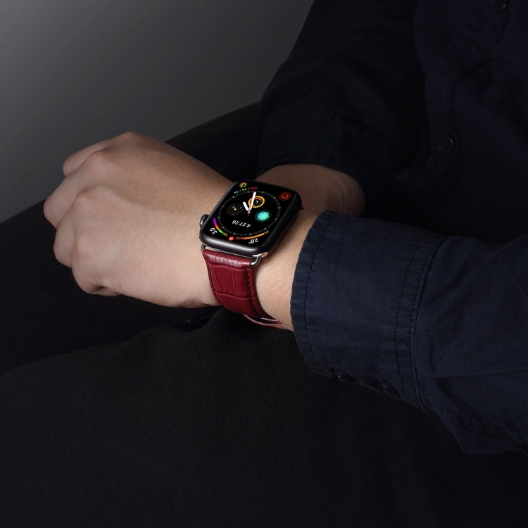 Dark red crocodile-grain leather Apple Watch band on a wrist