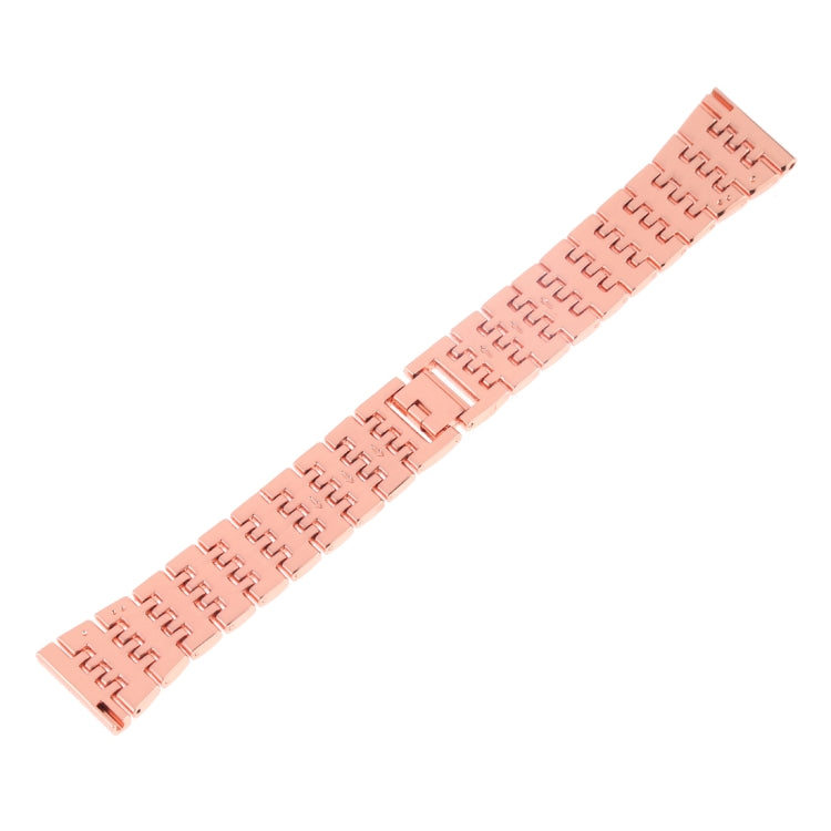Rose gold metal watch band with repeating link pattern and fold-over clasp end.