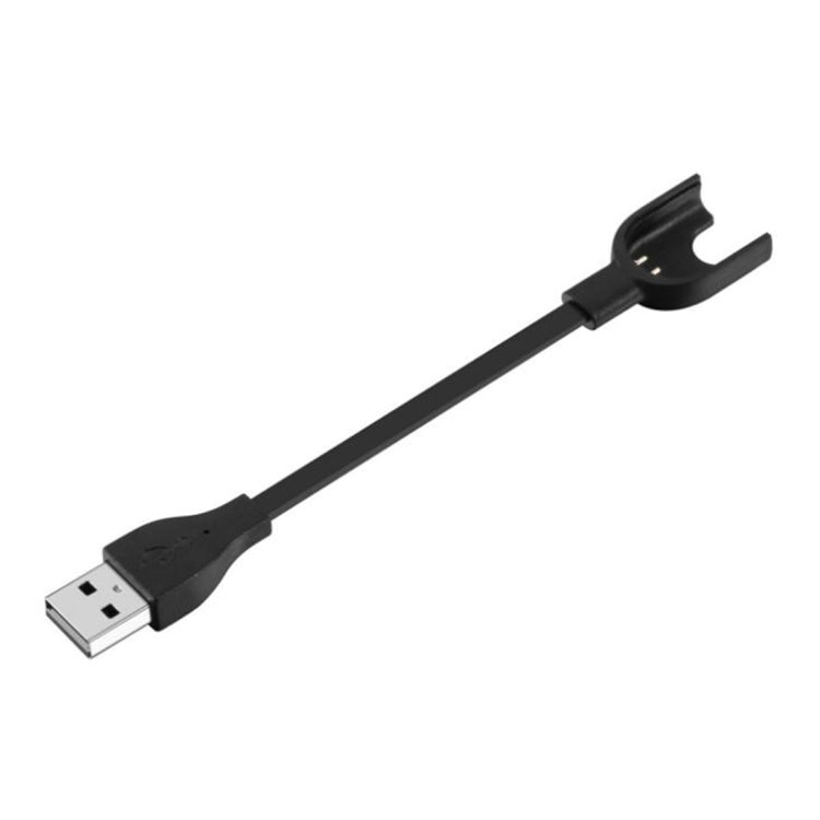 Black USB-A charging cable with clip-style cradle for fitness tracker