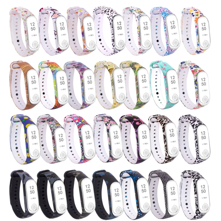 Set of silicone watch bands with multiple patterns and white perforated straps, fitness tracker displays