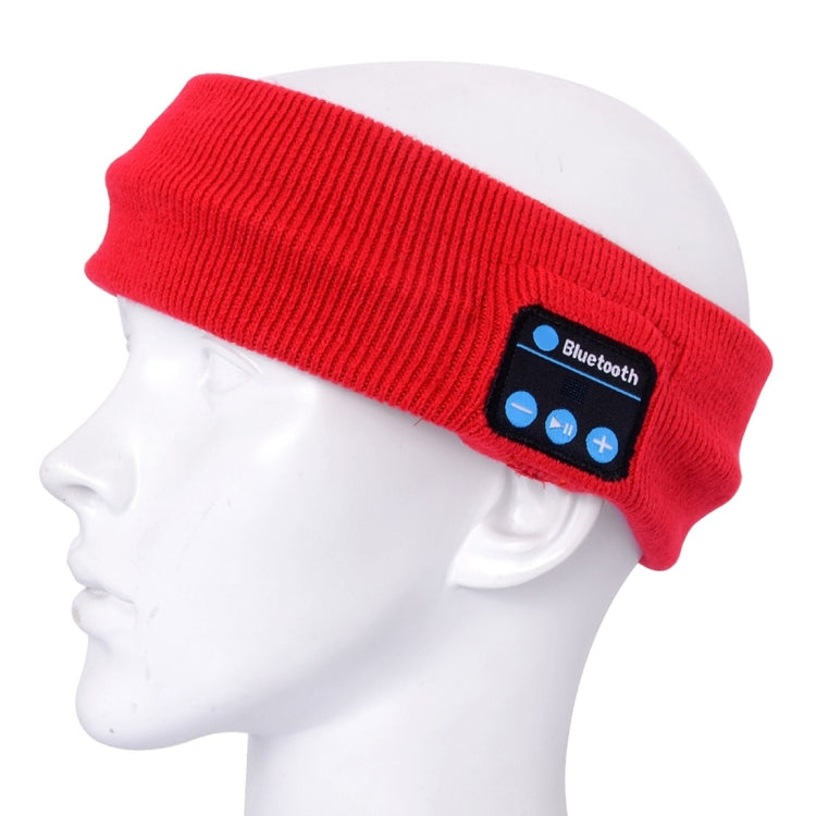 Red knitted Bluetooth headband on mannequin head with blue button control panel