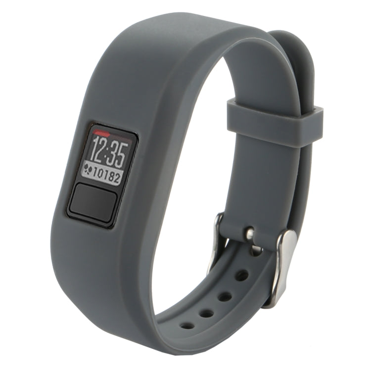 Grey silicone smartwatch band with digital screen, metal pin, and perforated strap
