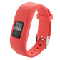 Red silicone smartwatch band with digital screen, metal pin, and perforated strap