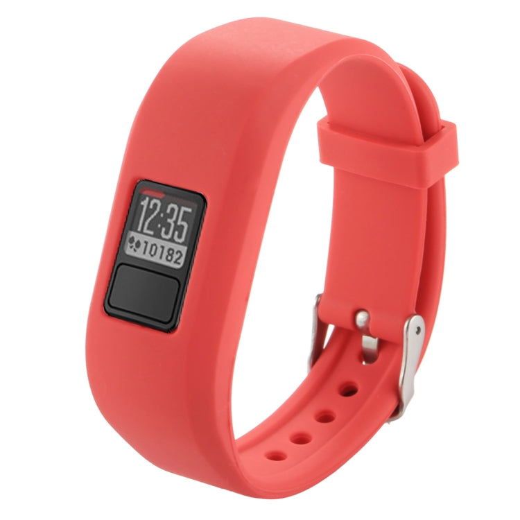 Red silicone smartwatch band with digital screen, metal pin, and perforated strap