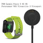 Desktop charging dock shown with green smartwatch band and charging connector