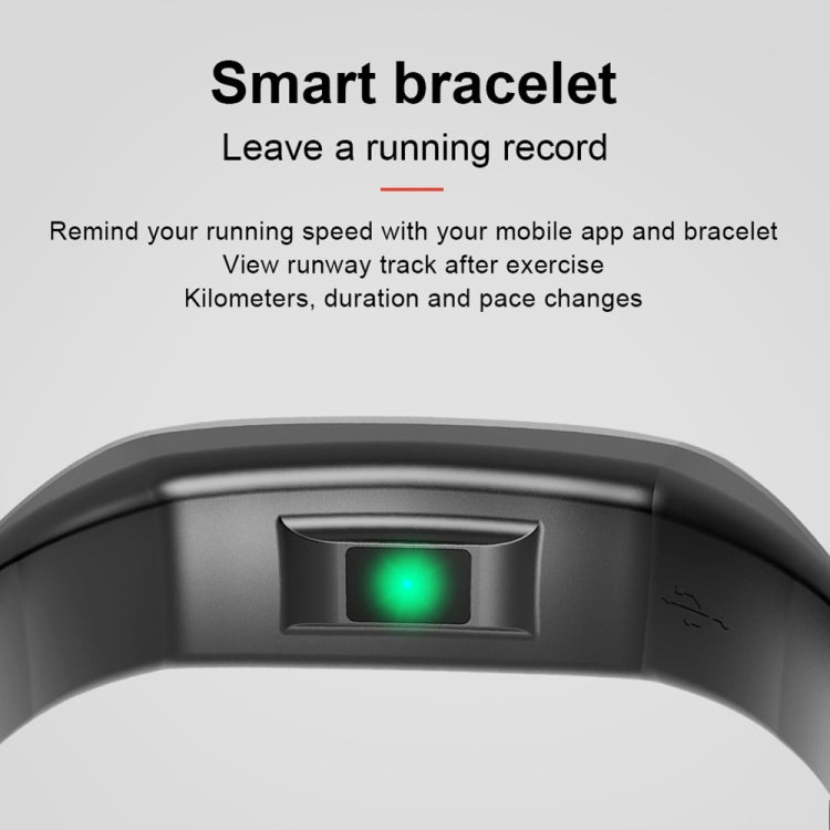 Black smart bracelet sensor area with glowing green light on the watch face.