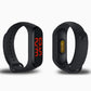 Black temperature monitoring bracelet, front and back view with red temperature screen