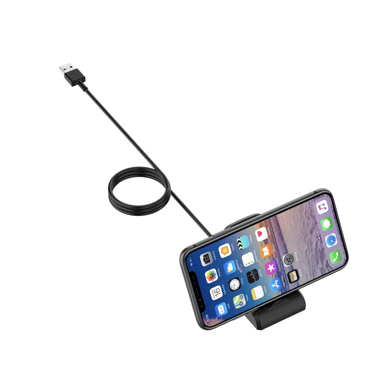 Black charging dock adapter holding a smartwatch with USB-A cable