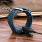 Blue Garmin watch band with charging clip and black charging data cable plugged in