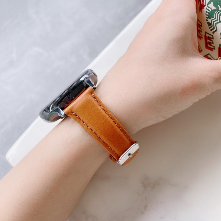 20mm double-sided leather watch band with buckle, warm orange-brown on wrist