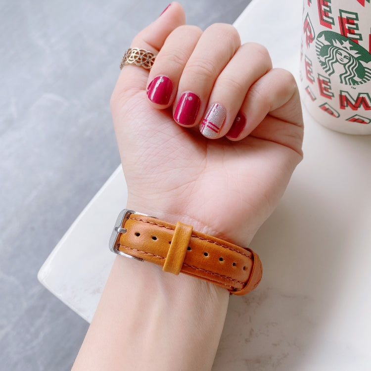 20mm double-sided leather watch band with buckle, light tan color on wrist