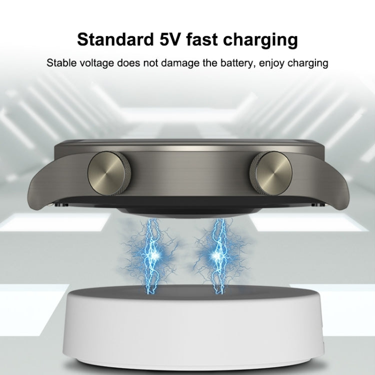 White wireless charging dock with watch positioned on top for charging