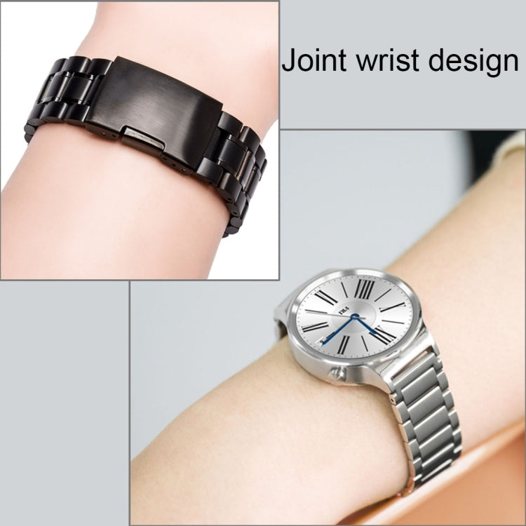 Metal link watch band on wrist, silver and black stainless steel styles