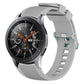 Grey silicone watch band with vertical grain ridges and adjustable buckle holes
