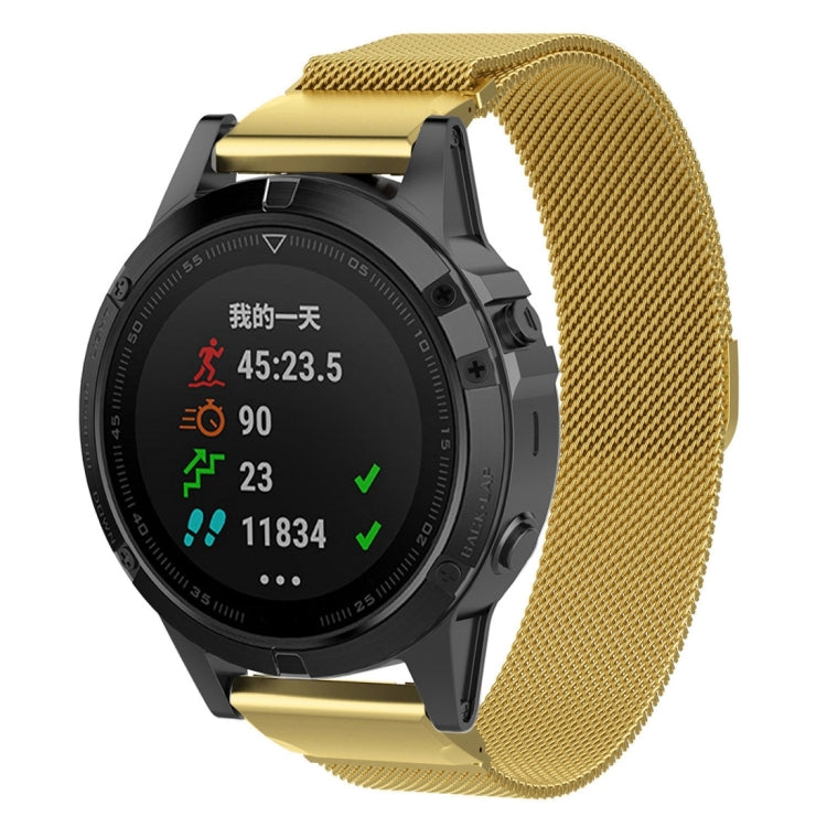 Gold milanese watch band with clasp on a round smartwatch
