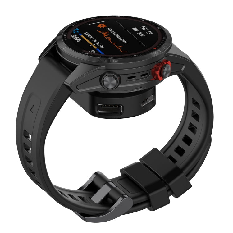 Black watch charging cradle dock with smartwatch resting on contacts