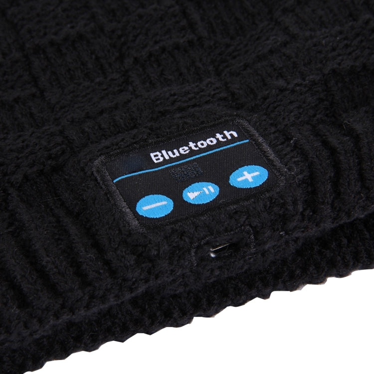Bluetooth control patch on black knit beanie with blue buttons and icons
