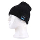 Black textured knit Bluetooth beanie on a mannequin head with control patch