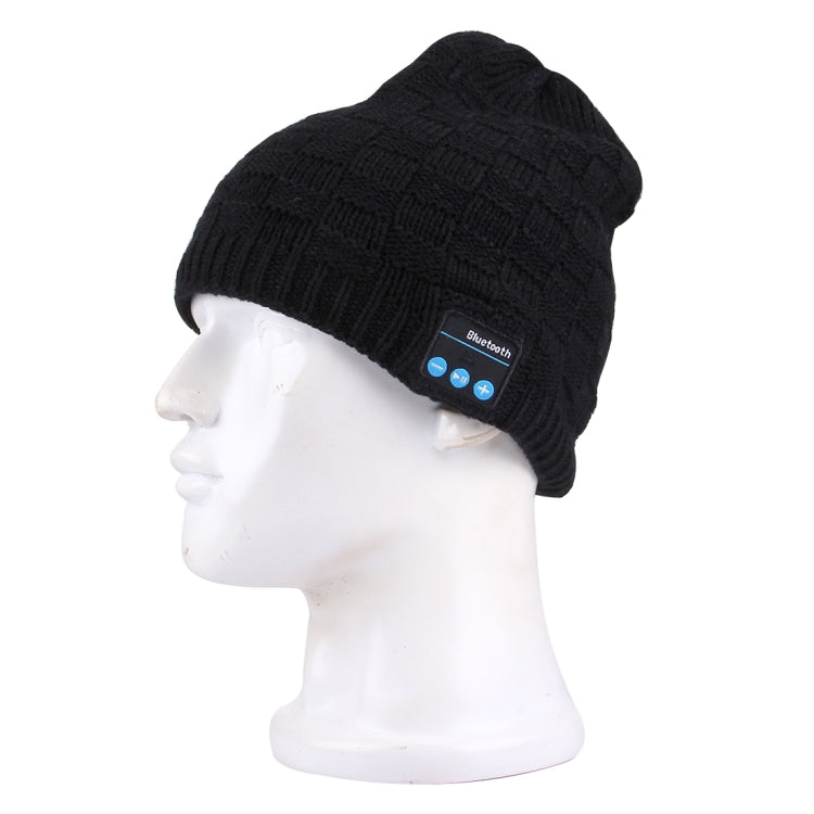 Black textured knit Bluetooth beanie on a mannequin head with control patch