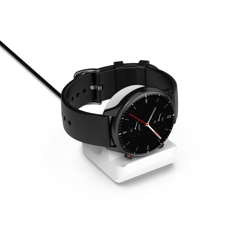 Black silicone charging bracket with cable and watch dock on white base.