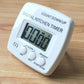 White digital kitchen timer with LCD count down display and blue start/stop controls