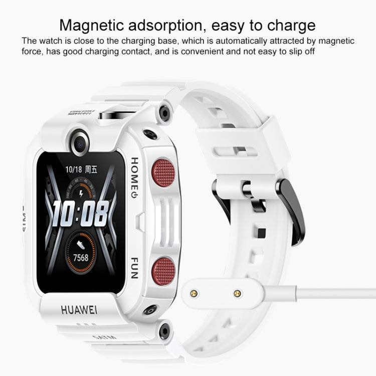 White Huawei watch with magnetic charging cable connected