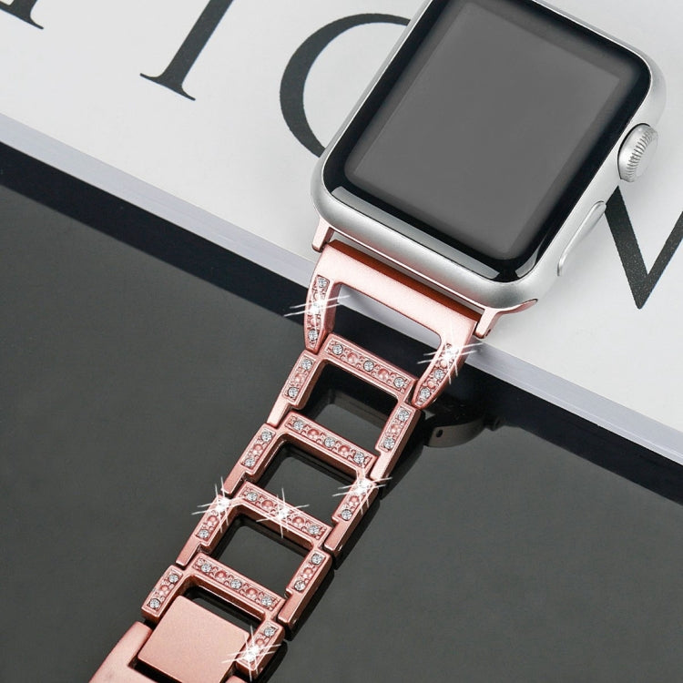 Rose gold diamond watch band close-up with faceted rectangular link pattern
