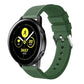 Dark green silicone smartwatch band with perforated strap and metal buckle clasp
