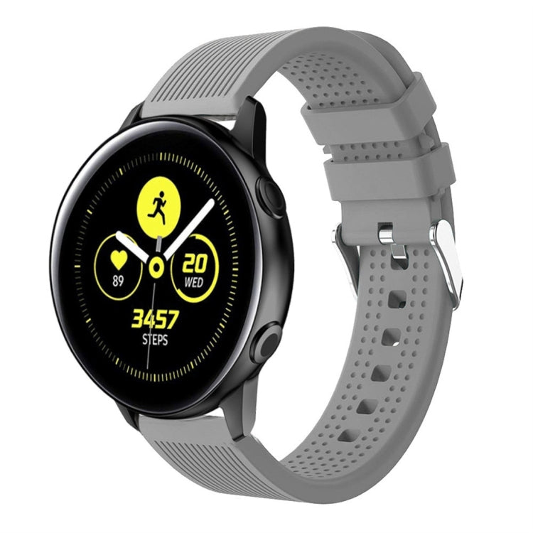 Grey silicone smartwatch band with perforated strap and metal buckle hardware