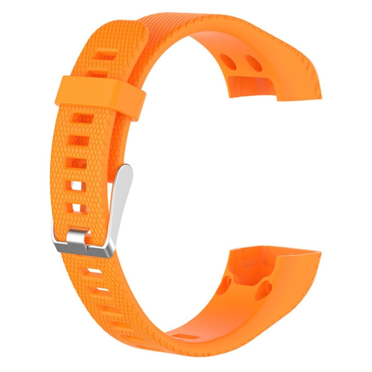 Orange silicone smartwatch strap shown from the side with metal clasp and vents