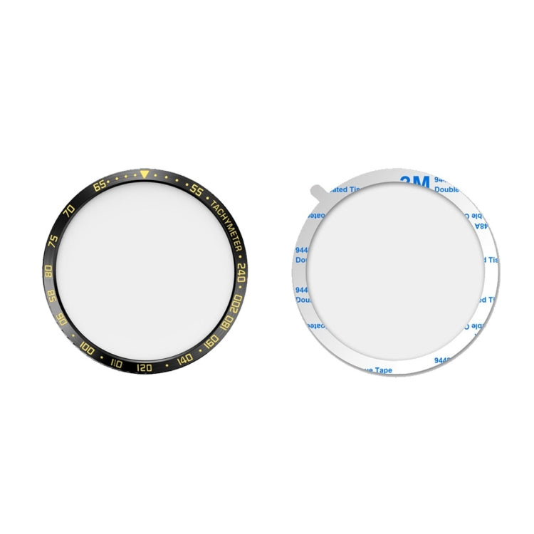 Two circular watch protector frames: black-gold rim and clear rim with blue tape