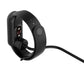 Black magnetic charging clip with pins and attached charging cable
