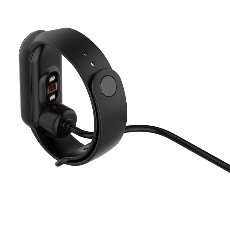 Black magnetic charging clip with pins and attached charging cable