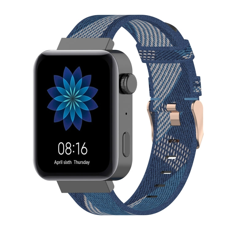 Blue striped nylon watch band with buckle and multiple adjustment holes.