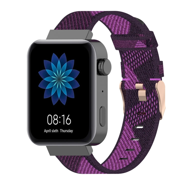 Purple striped nylon watch band with metal buckle and adjustable strap holes.
