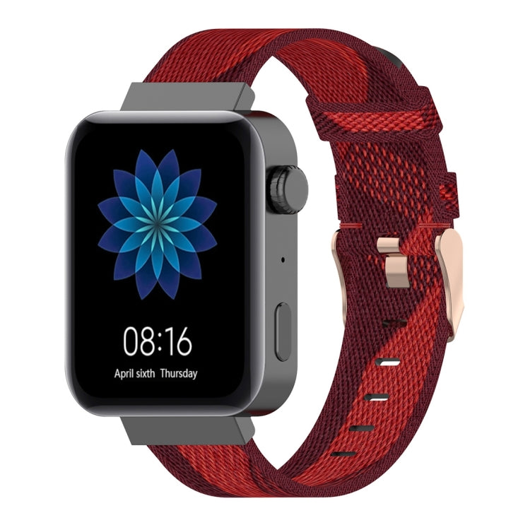 Red striped nylon watch band with metal buckle and adjustable pin holes.