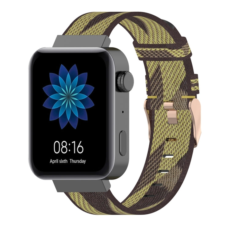 Olive and yellow striped nylon watch band with metal buckle and adjustment holes.