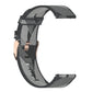 Grey 20mm stripe weave nylon watch band shown from side with rose-gold buckle