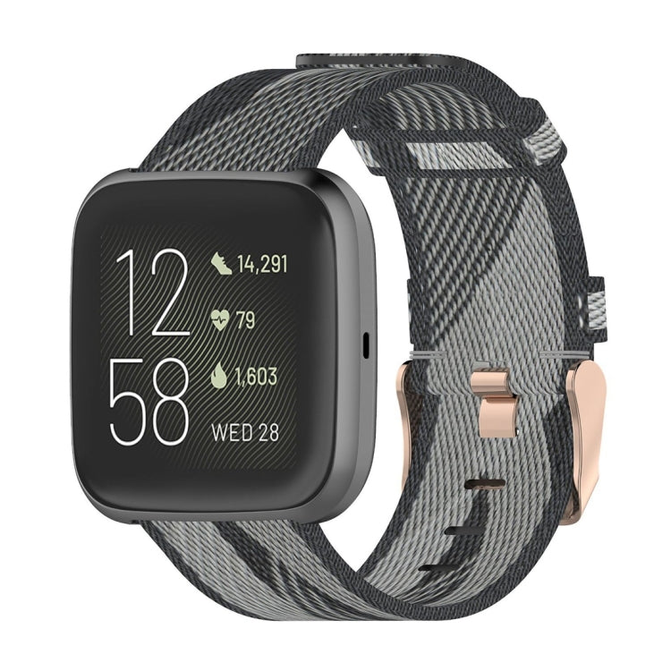 Woven nylon watch strap with grey and dark camo stripe pattern, metal pin buckle.
