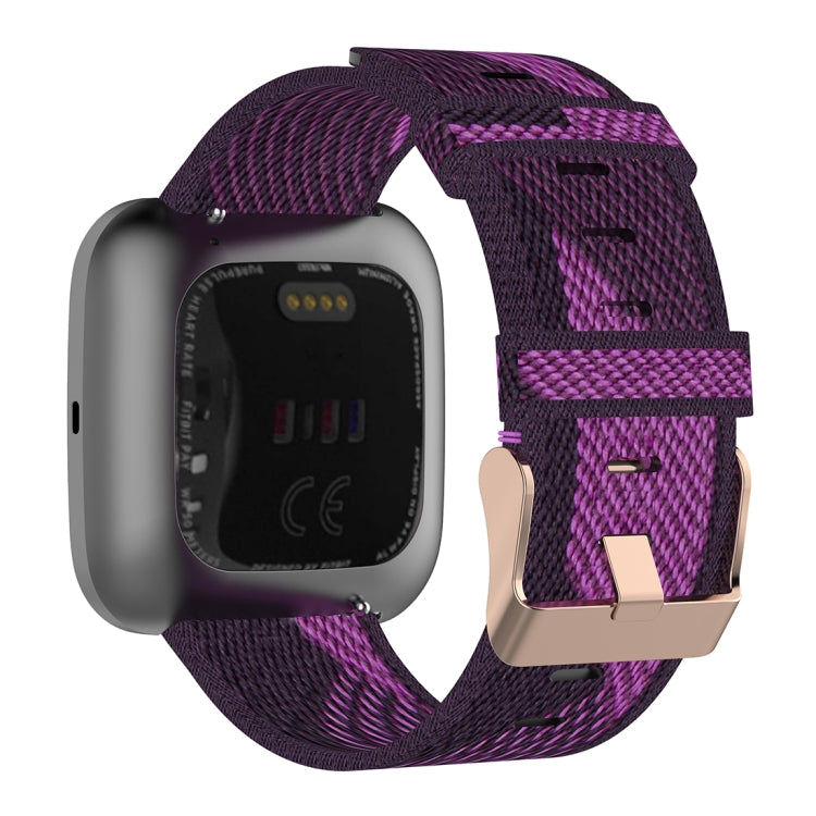 23mm purple woven nylon watch strap with metal buckle and strap keeper loop.