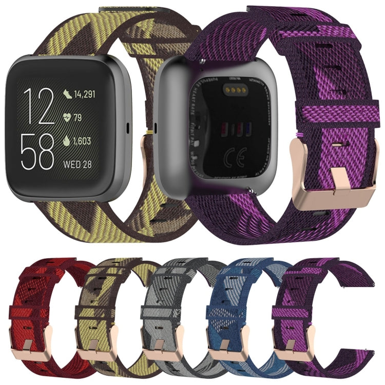 Set of woven nylon watch straps in multiple colors, each with metal pin buckle.