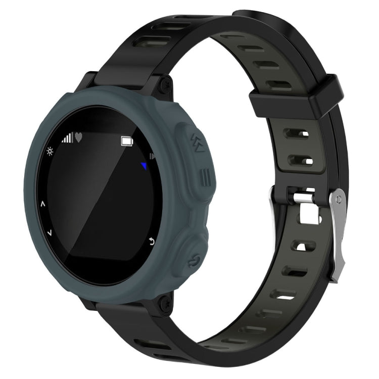 Gray silicone protective watch case with cutouts and buttons, on black strap