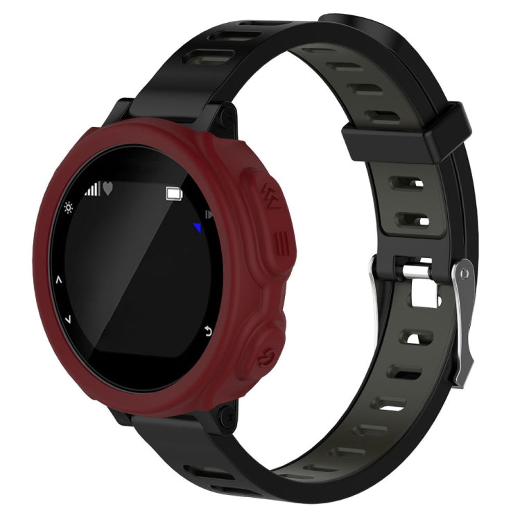 Red silicone protective watch case with cutouts and buttons, on black strap