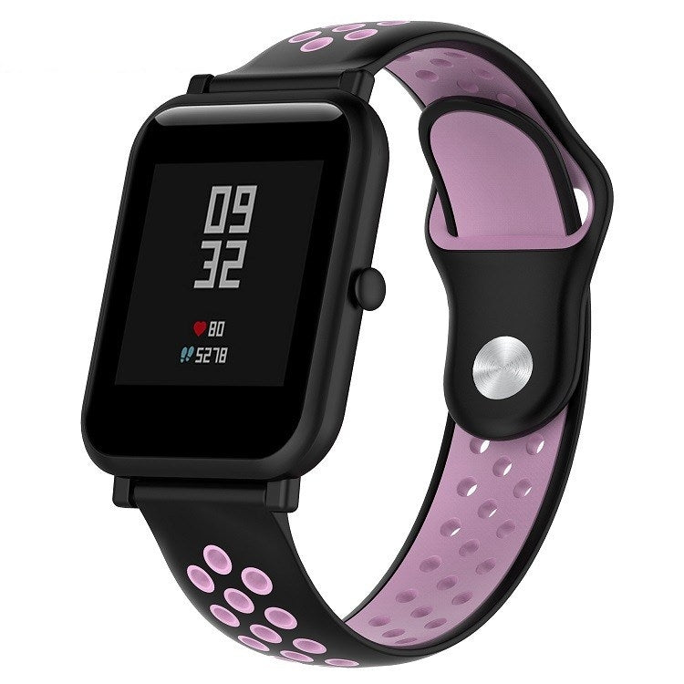 Silicone sport watch band with black and pink perforated straps, black watch case
