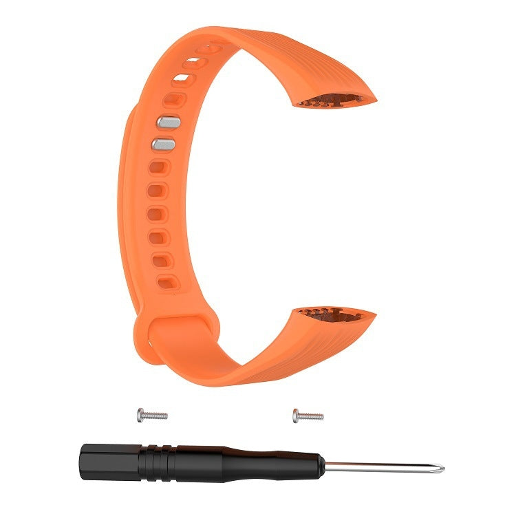 Orange silicone watch band with clasp, pins, and screwdriver tool