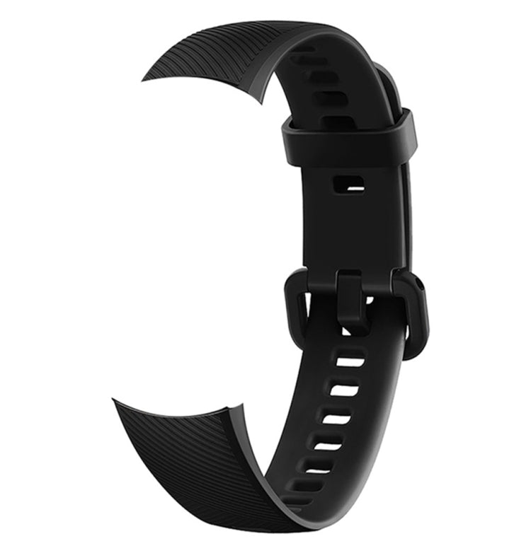 Black silicone watch band with textured strap end and adjustable buckle