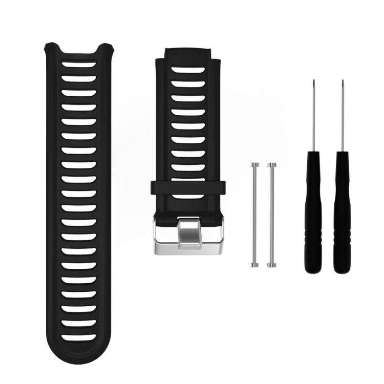 Black silicone watch band with ridged strap and metal clasp, plus extra pin tools