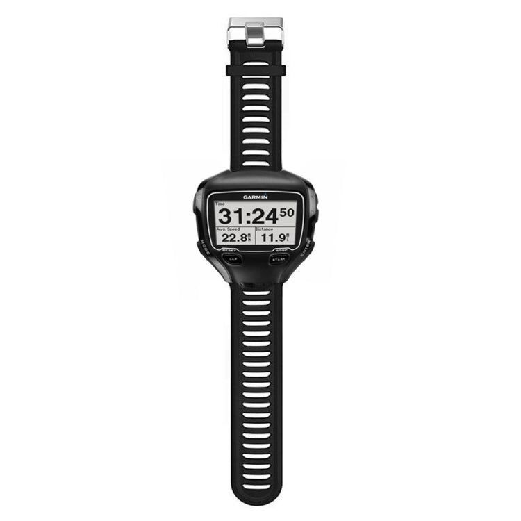 Black silicone watch band with metal buckle, worn on a round smartwatch display
