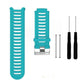 Teal silicone watch band with ridged strap and metal clasp, with extra pin tools