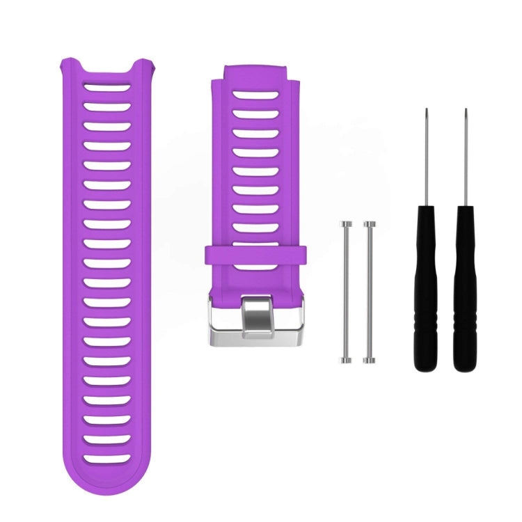 Purple silicone watch band with ridged strap and metal clasp, with extra pin tools